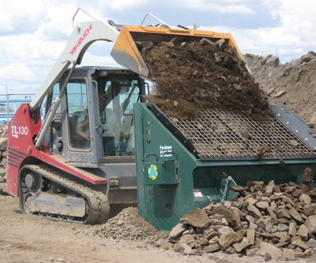 Topsoil screening equipment working on site